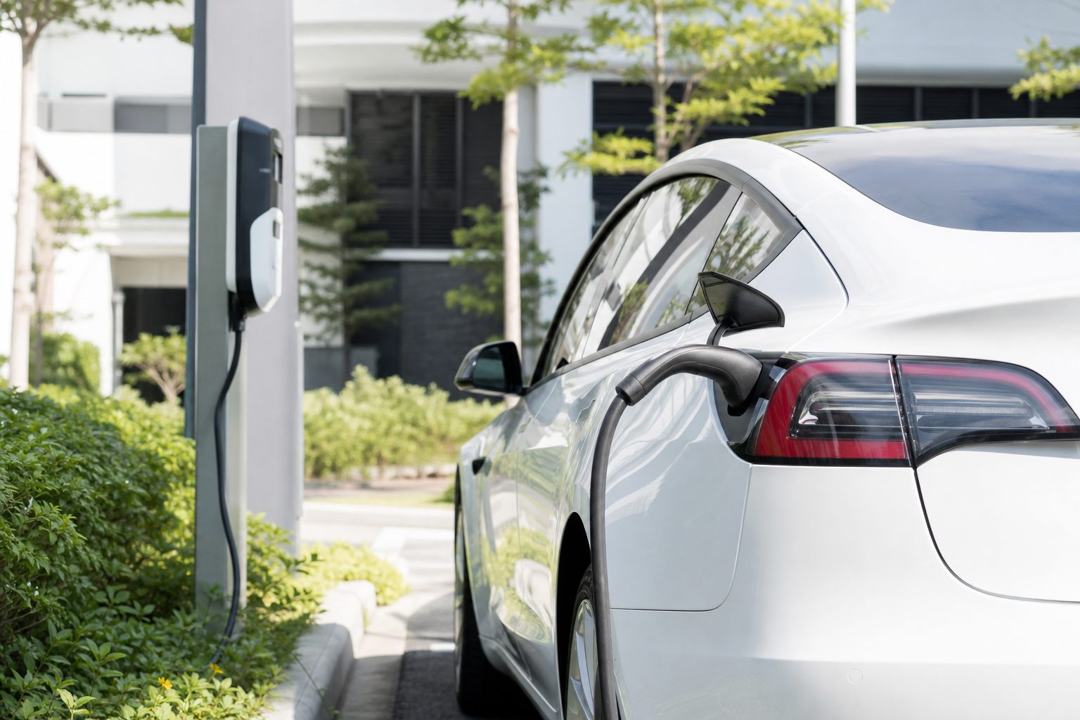 EV road tax calculator - electric car at a charging station